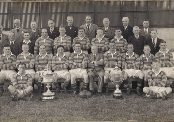 Warrington championship squad 1948 with two trophies